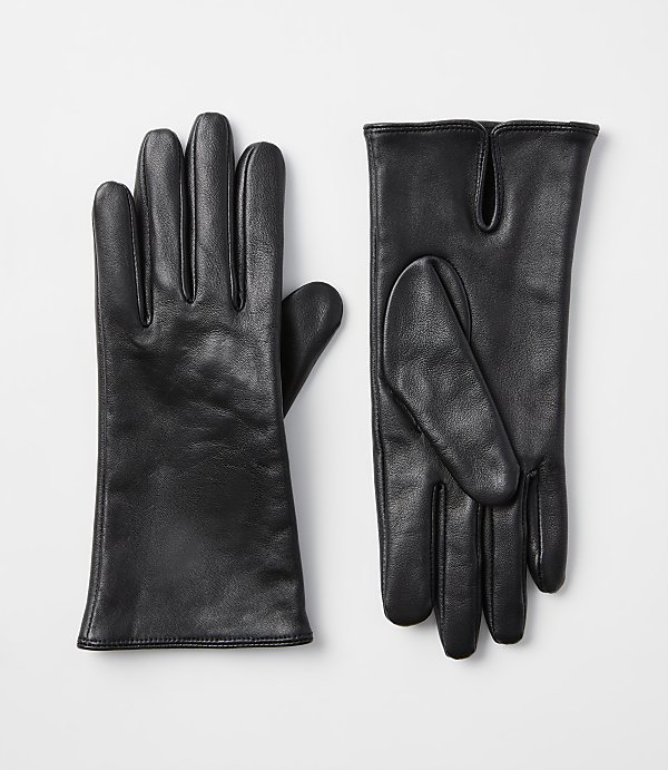 A pair of black leather gloves lies on a plain white background.