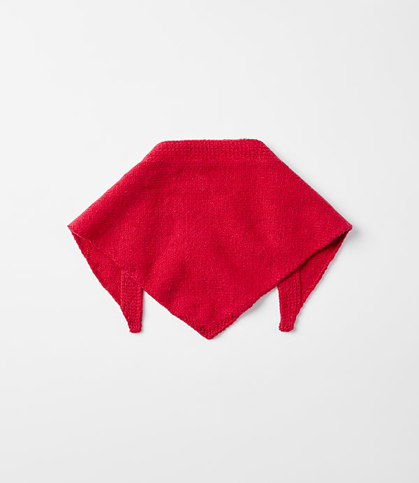 A red knitted bandana lies centered on a plain, light gray background.