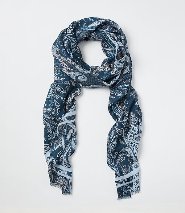 A teal paisley-patterned scarf is laid out against a plain white background.