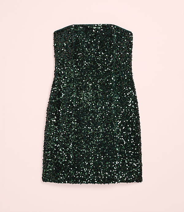 A sparkling dark green sequined mini dress is centered against a plain light pink background.