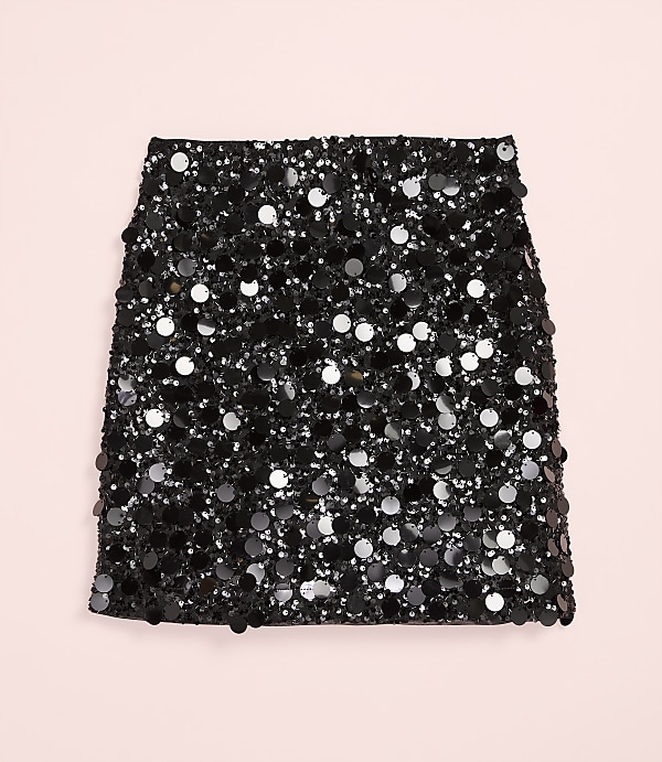 A black sequined skirt is centered against a plain light pink background.