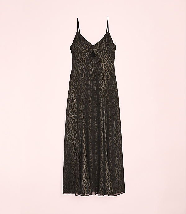 A black leopard-print slip dress hangs against a plain light pink background.