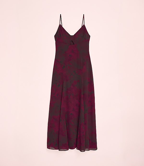 A maroon floral print slip dress is centered against a plain light pink background.