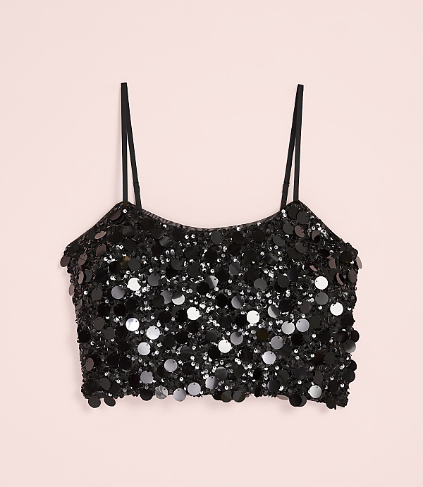 A black sequined crop top with thin straps is centered against a plain light pink background.