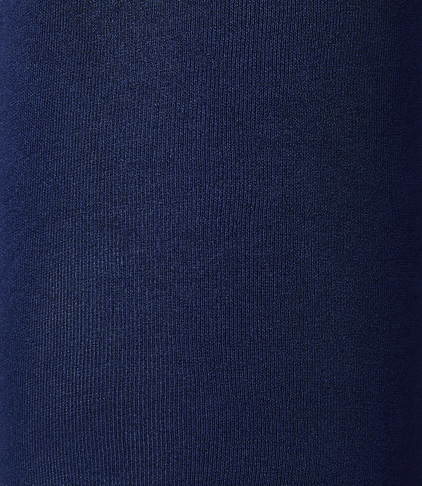 A close-up view of dark blue ribbed fabric fills the frame, with no discernible background.