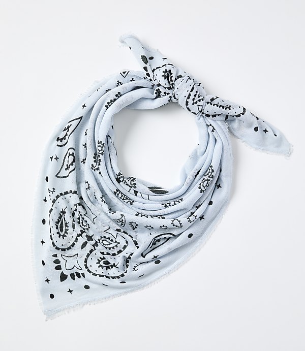 A light blue paisley-patterned bandana is tied in a knot against a plain white background.