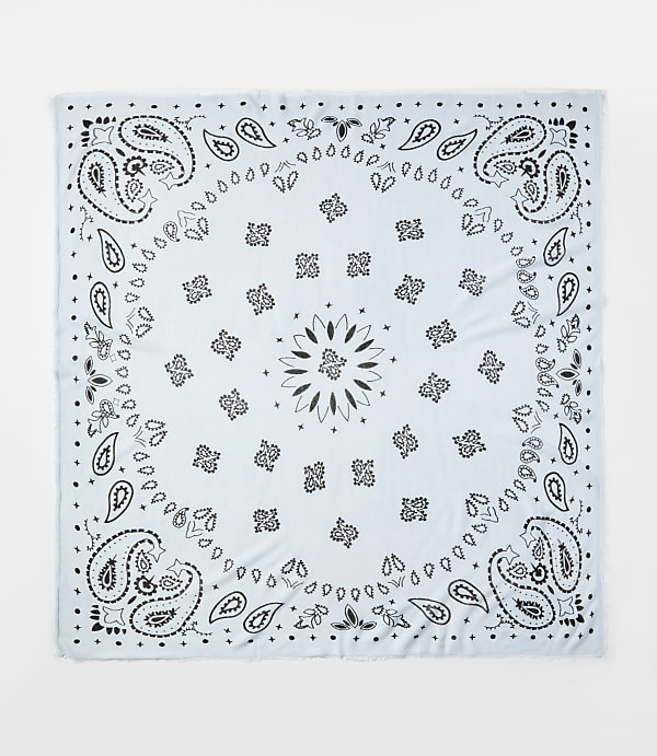 A light blue bandana with black paisley patterns is centered against a plain white background.