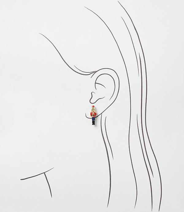 A small toy soldier stands in the foreground against a background of a minimalist line drawing of a woman's profile.
