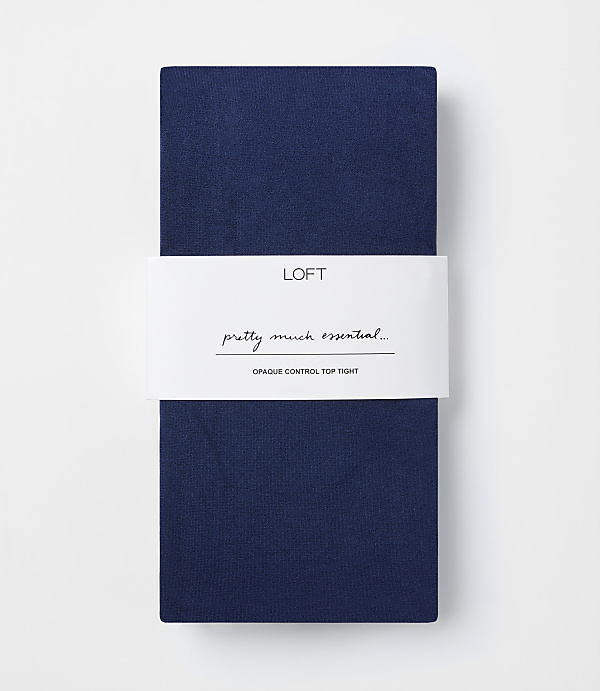 A folded pair of navy blue opaque control top tights with a white band in the middle featuring the "LOFT" logo and text, against a plain white background.