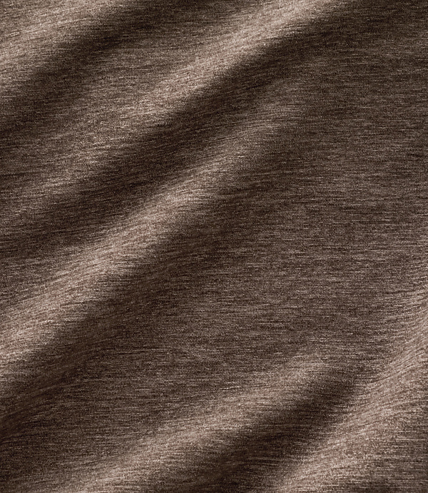 Brown textured fabric with soft folds in the foreground and a consistent woven pattern in the background.