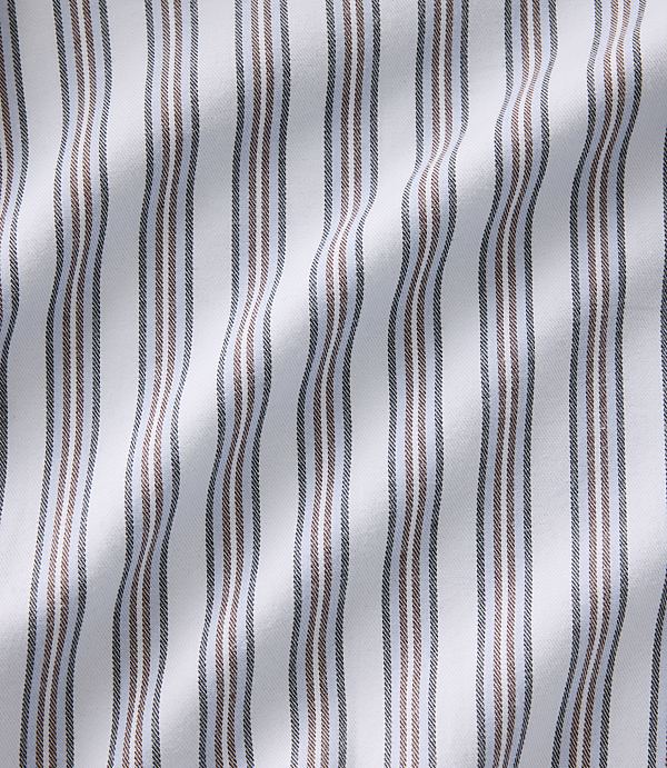 Vertical brown and grey stripes run across a white, undulating fabric background.