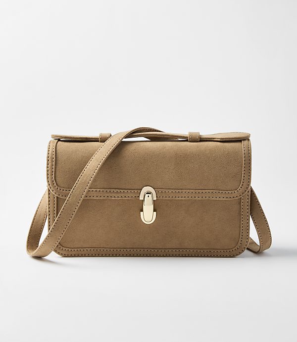 A tan suede crossbody bag with a gold clasp sits centered against a plain white background.
