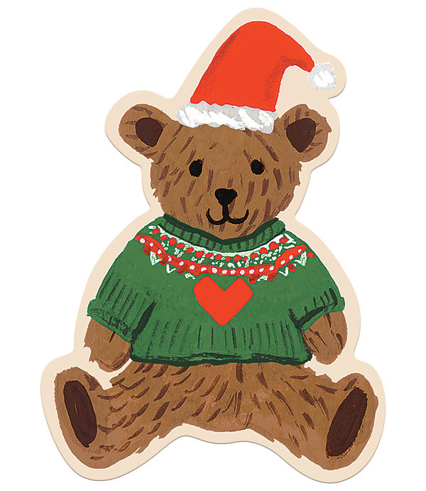 A brown teddy bear wearing a red Santa hat and a green sweater with a red heart sits against a plain white background.