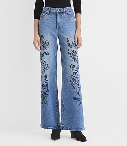 Rivete Petite Curvy Floral Embroidered Mid Rise Wide Leg Jeans in Medium Fade Wash