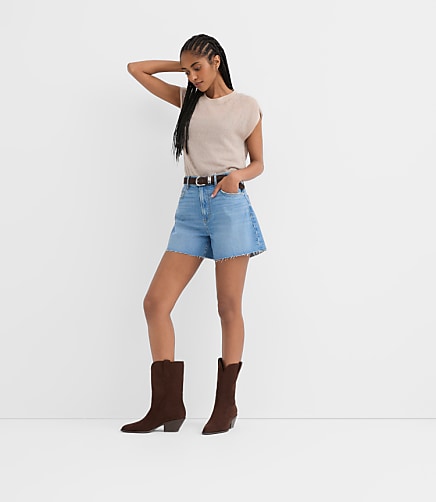 Rivete High Rise Cut Off Denim Shorts in Mid Wash