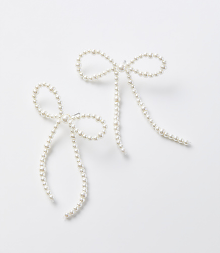 Pearlized Bow Drop Statement Earrings