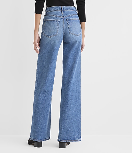 Rivete Petite Curvy Floral Embroidered Mid Rise Wide Leg Jeans in Medium Fade Wash